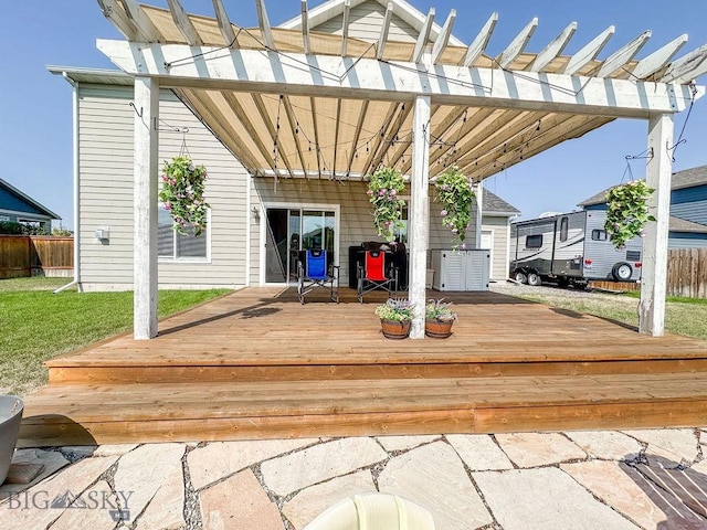 wooden deck with a pergola and a yard