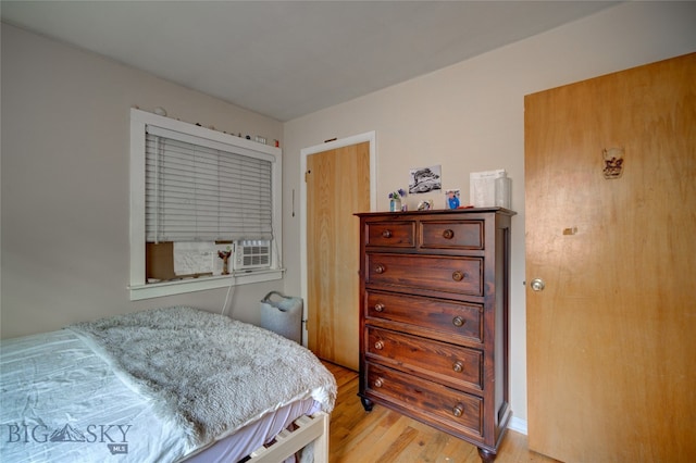 bedroom with light wood-type flooring