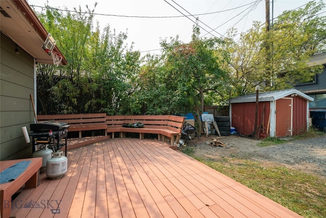 wooden terrace with a shed