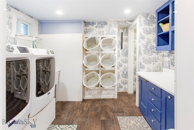 laundry room with dark hardwood / wood-style floors and independent washer and dryer