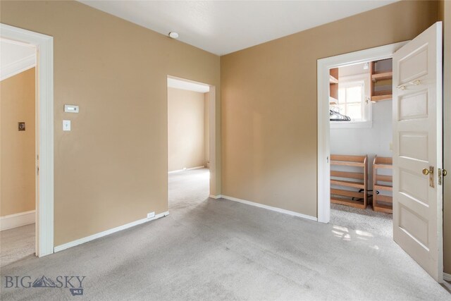 unfurnished bedroom with light colored carpet