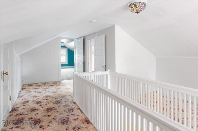 bonus room with light carpet and lofted ceiling