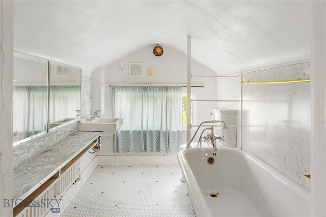 bathroom featuring lofted ceiling, separate shower and tub, and tile patterned flooring