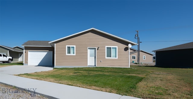 view of front facade featuring a garage and a front yard