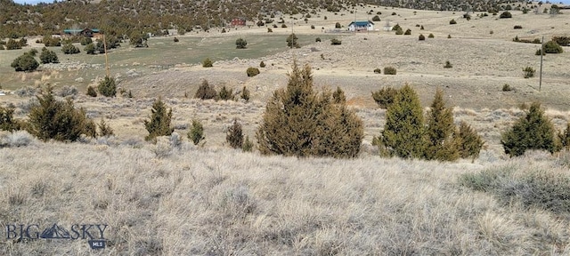 exterior space with a rural view