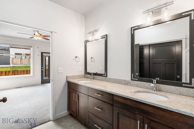 bathroom featuring tile patterned floors, ceiling fan, and vanity