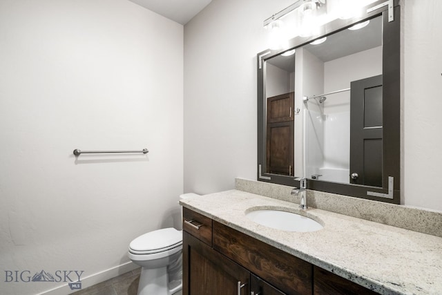 bathroom featuring vanity, toilet, a shower, and tile patterned flooring