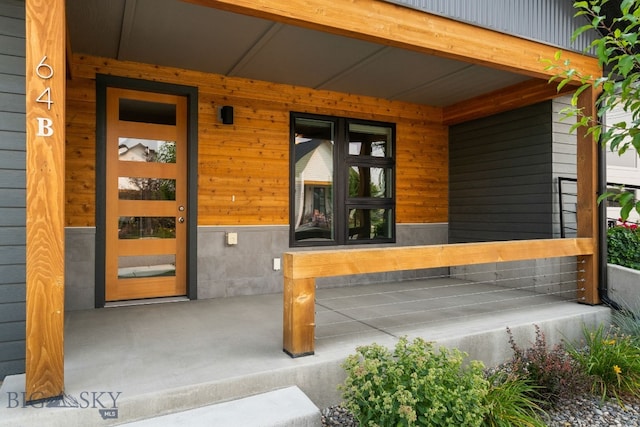 entrance to property with covered porch