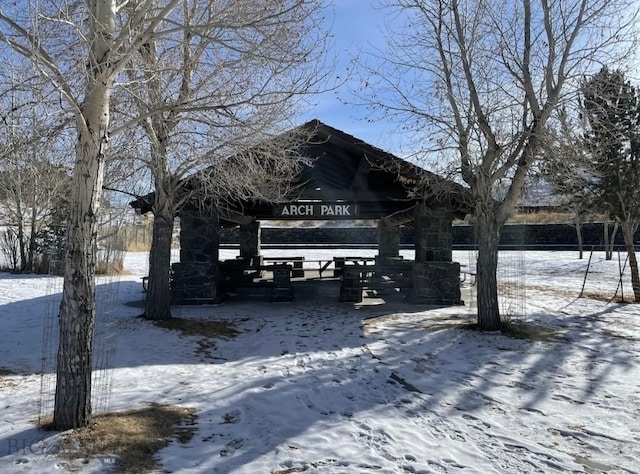 snowy yard featuring a gazebo