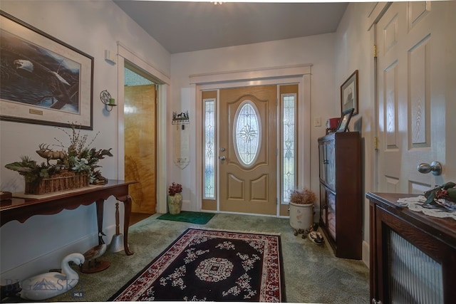 view of carpeted entrance foyer