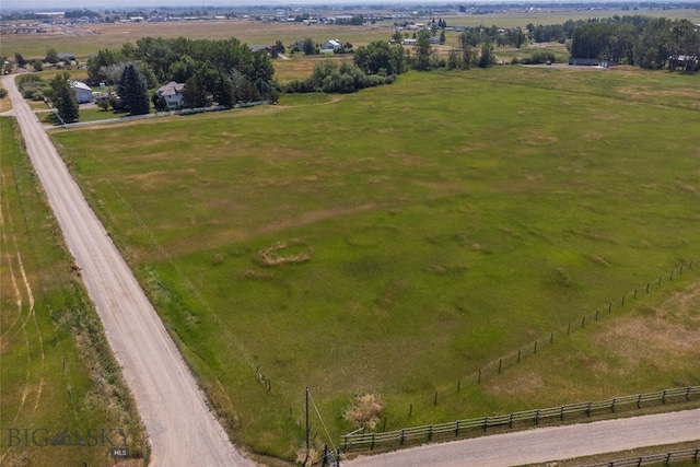 birds eye view of property with a rural view