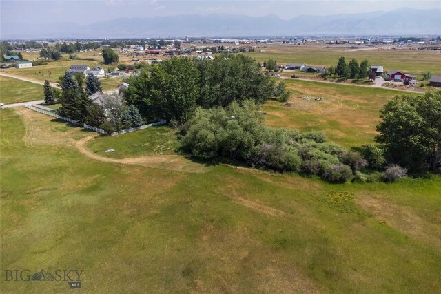 drone / aerial view featuring a rural view and a mountain view