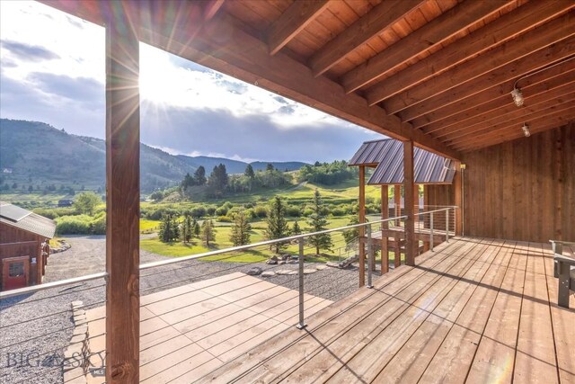 wooden terrace with a mountain view and a rural view