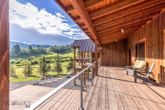 wooden deck with a mountain view and a rural view