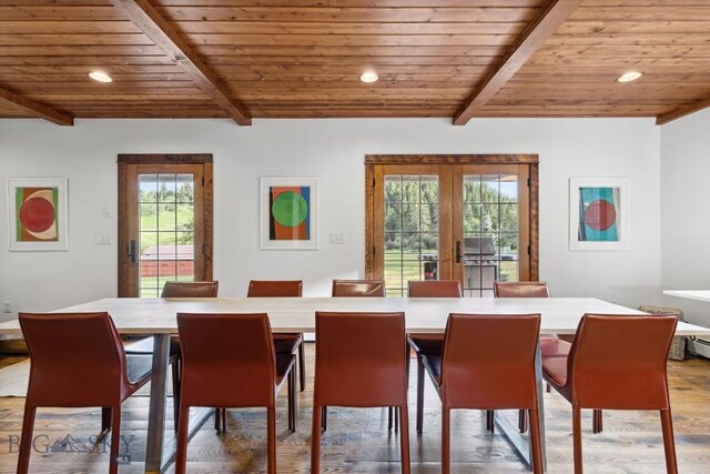 dining space featuring beam ceiling, hardwood / wood-style flooring, french doors, and wooden ceiling