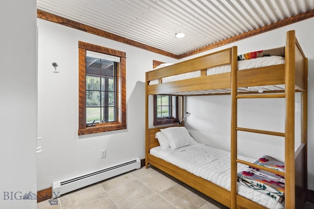 bedroom featuring wooden ceiling and a baseboard heating unit