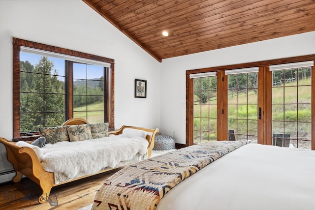 bedroom with multiple windows, wooden ceiling, hardwood / wood-style flooring, and lofted ceiling