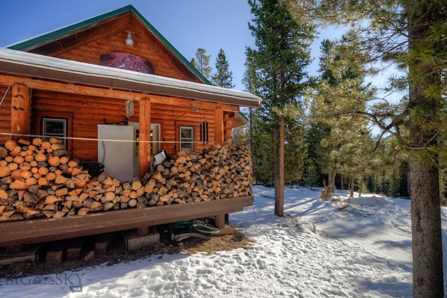 view of snow covered property