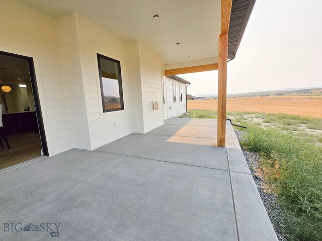 view of patio / terrace with a rural view