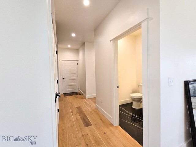 hallway with light wood-type flooring