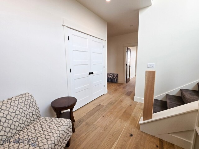 sitting room with light hardwood / wood-style flooring