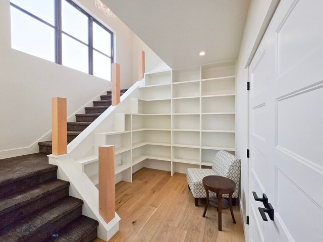 stairway featuring hardwood / wood-style floors