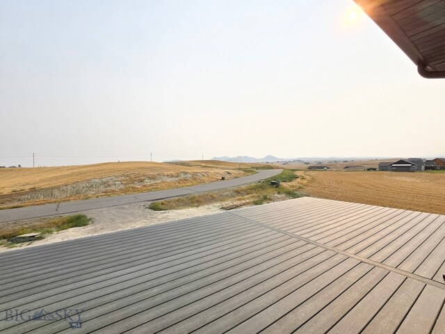 wooden deck featuring a rural view