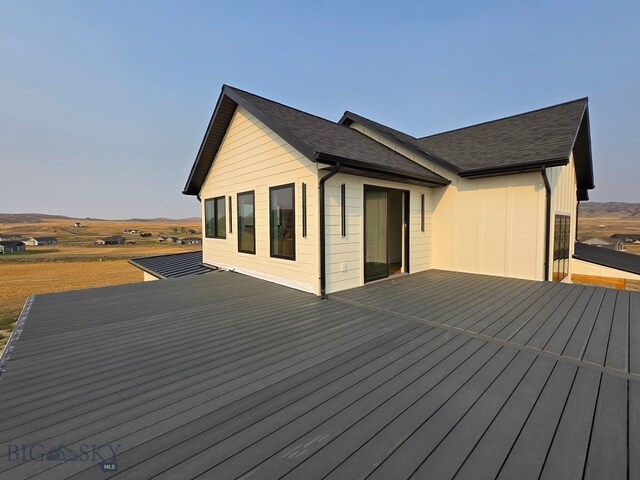 wooden terrace with a rural view