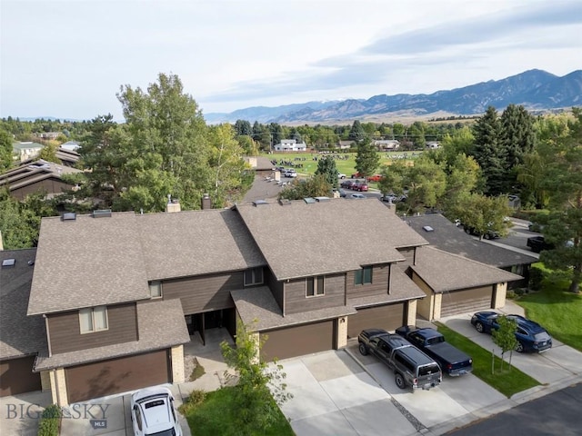 birds eye view of property featuring a mountain view