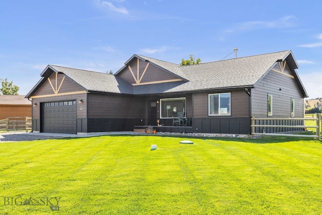 ranch-style house featuring a garage and a front yard