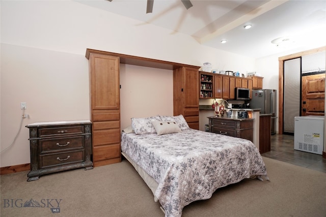 bedroom with ceiling fan, light colored carpet, and stainless steel fridge