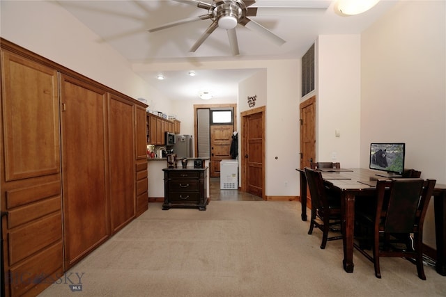 interior space with ceiling fan and light colored carpet