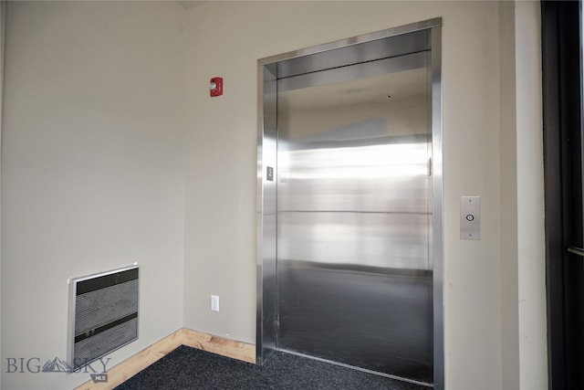 interior space with heating unit and elevator