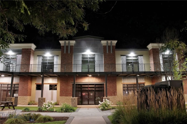 view of front of property with a balcony