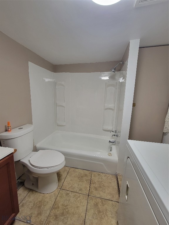 full bathroom featuring shower / washtub combination, tile patterned flooring, vanity, and toilet