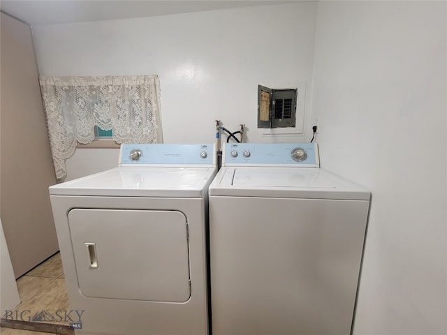 laundry room featuring light tile patterned flooring and washer and dryer