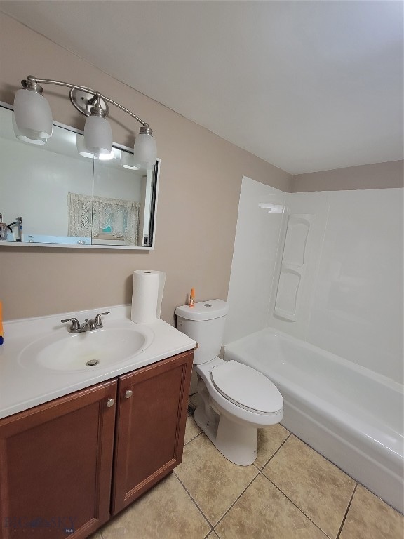 full bathroom with vanity, tile patterned flooring, toilet, and shower / washtub combination