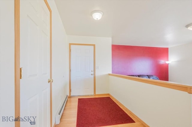 285 Mt Highway 55, Whitehall, MT 59759 - hall with a baseboard heating unit, baseboards, and light wood-style floors
