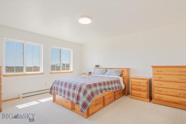 285 Mt Highway 55, Whitehall, MT 59759 - carpeted bedroom with a baseboard heating unit