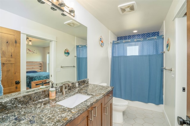 full bathroom with shower / bath combination with curtain, vanity, tile patterned flooring, and toilet