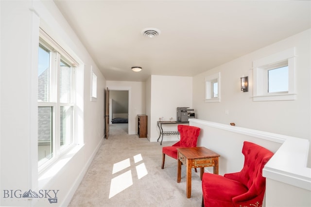 living area with light colored carpet