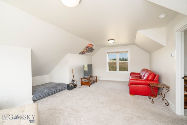 living area with light colored carpet and lofted ceiling