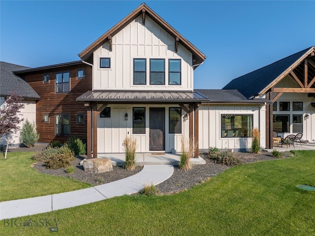 modern farmhouse style home with a front yard and a porch