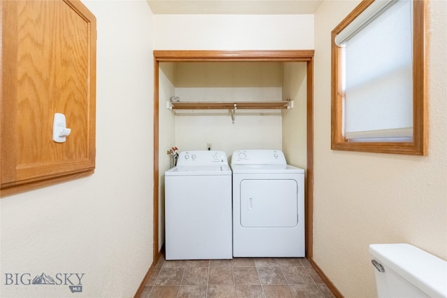 laundry room featuring separate washer and dryer