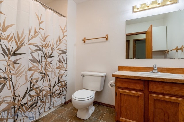 bathroom with tile patterned flooring, a shower with curtain, vanity, and toilet