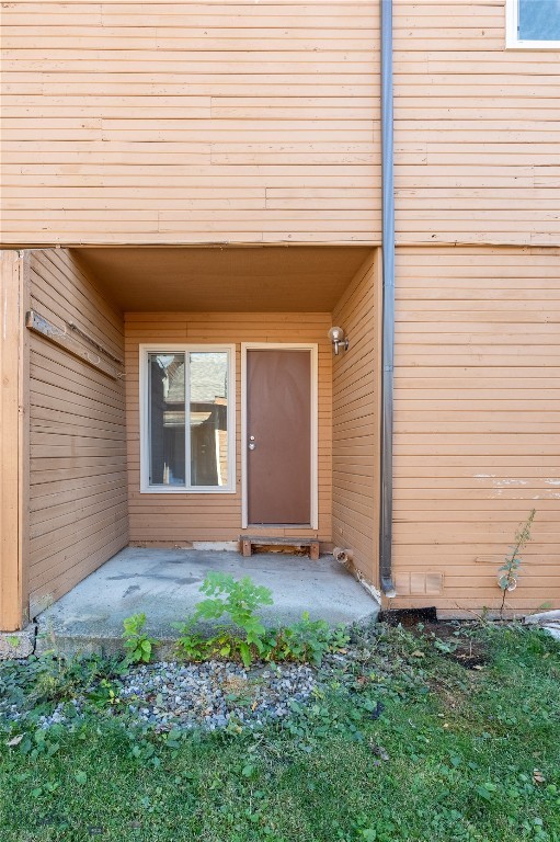 property entrance with a patio