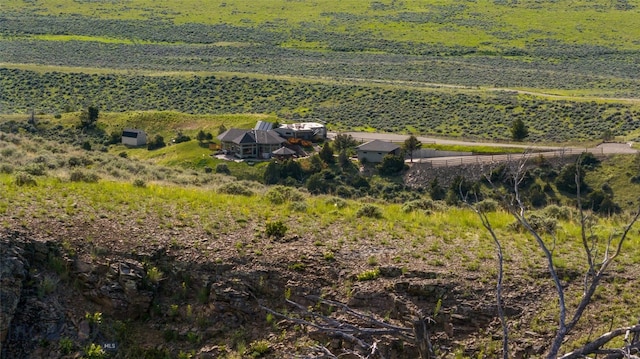 birds eye view of property featuring a rural view