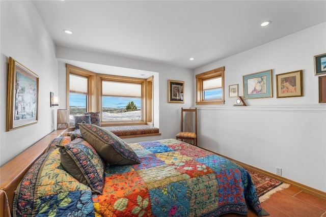 tiled bedroom featuring multiple windows