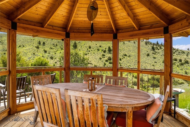 sunroom / solarium with wooden ceiling and vaulted ceiling with beams