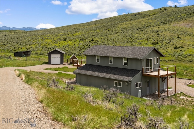 exterior space with a mountain view and a rural view